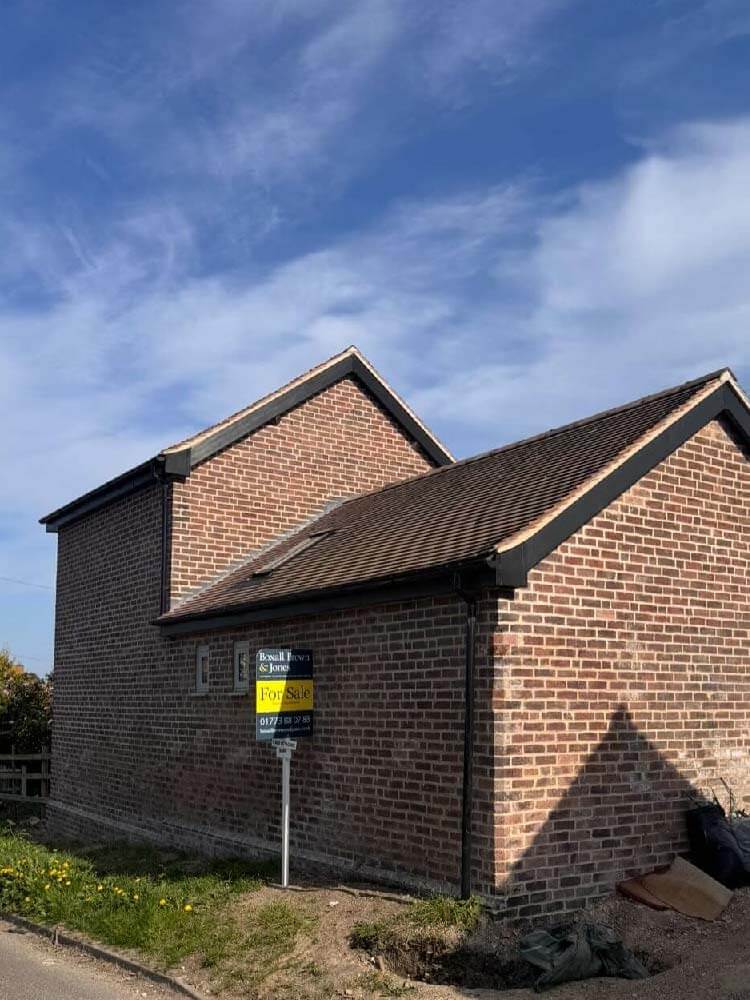 Completed barn conversion roofing project in Loscoe combining traditional style and modern materials