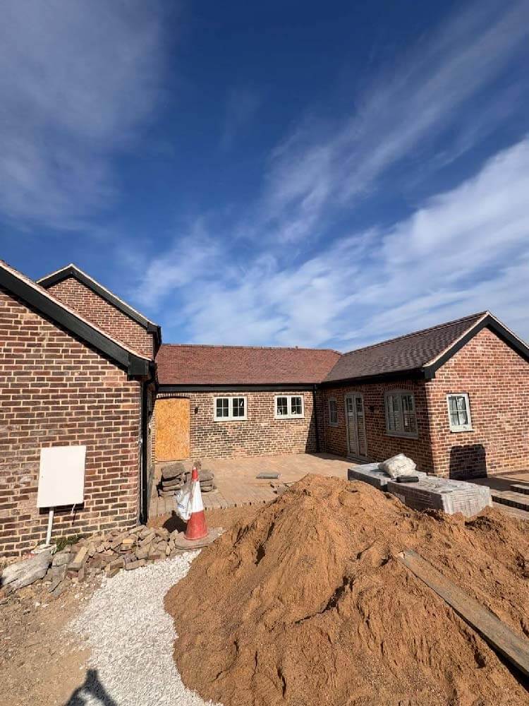 View of barn conversion roof from ground level on property in Loscoe