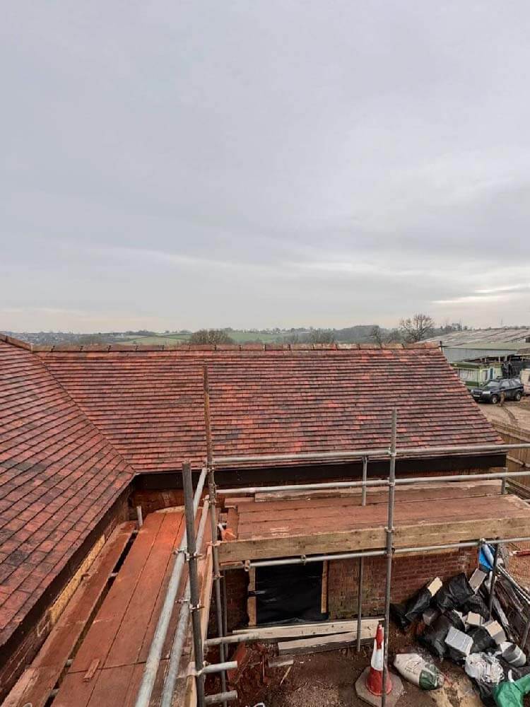 Top-down view of completed slate roof on barn conversion in Loscoe