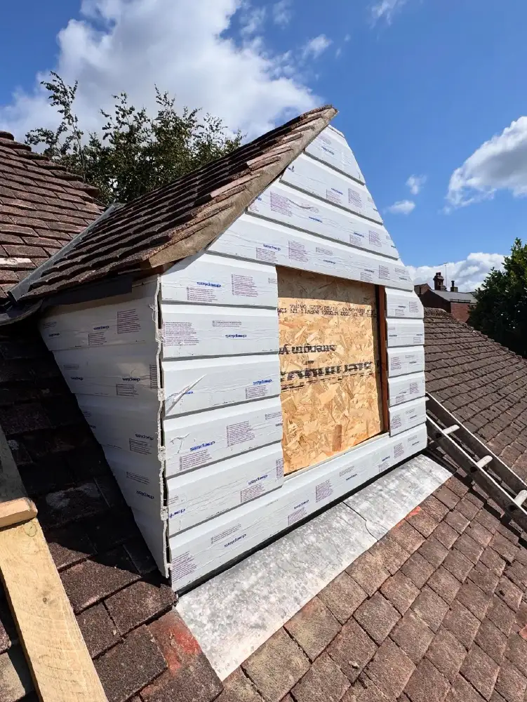 PVC cladding being fitted to new dormer on residential property