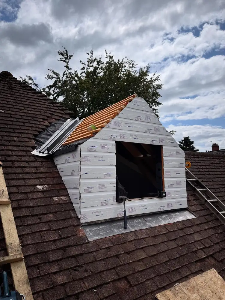 Completed dormer with pitched roof and cladding by Holt Roofing Ltd