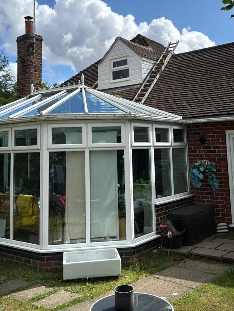 Completed dormer with pitched roof and cladding by Holt Roofing Ltd