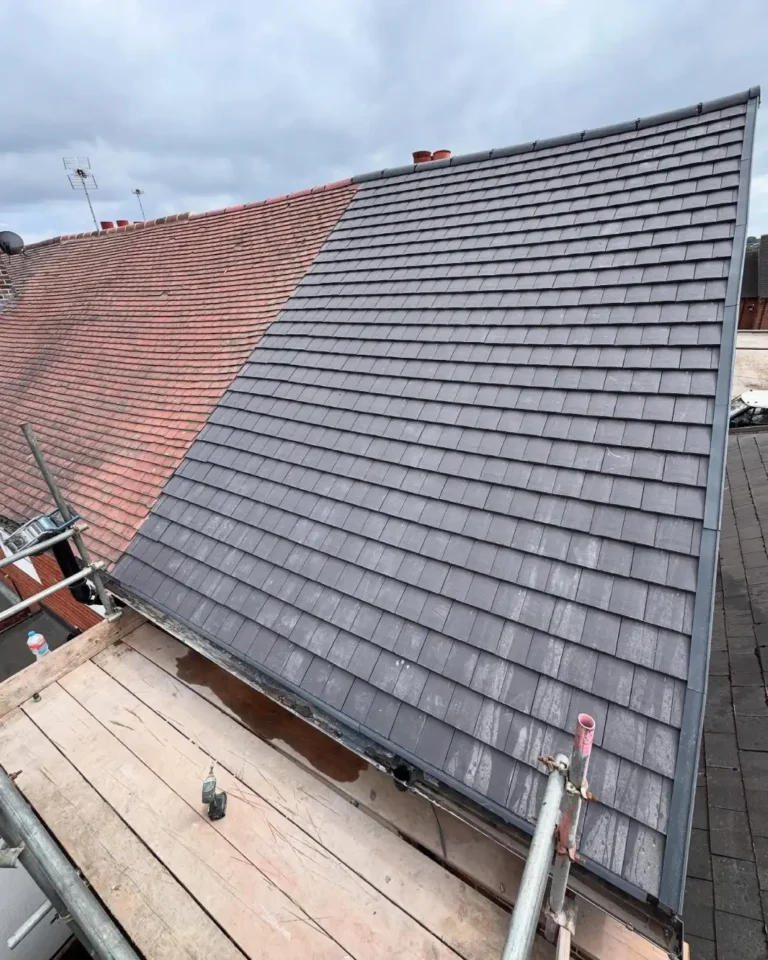 Rear view of the fully finished roof showing clean tiles and dry verge caps.