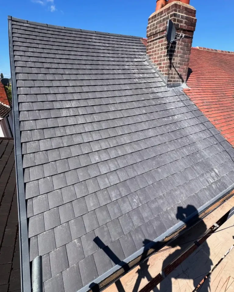 Front view of the finished roof section with tiles and dry ridge system.