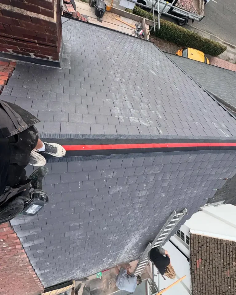 Top-down view showing both sides of the finished roof with neat tile work.