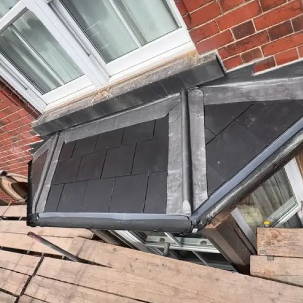 Bay window roof in Derbyshire with fresh lead flashing repair