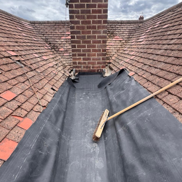 Lead valley roof repair showing new lining in Derbyshire