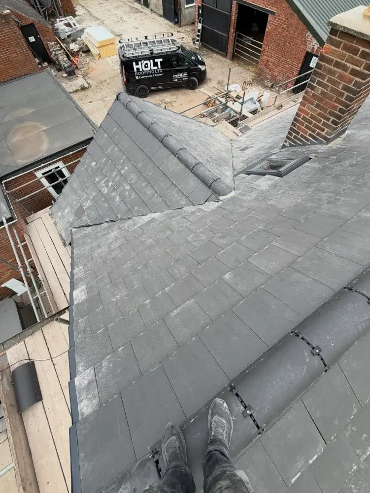 Detailed view of tiled roof valley during full roof replacement in Langley Mill, Derbyshire.