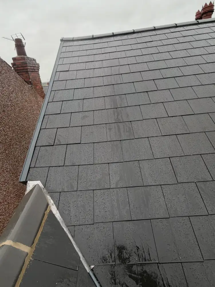 Cement fibre slate reroof showing slate layout and fixings