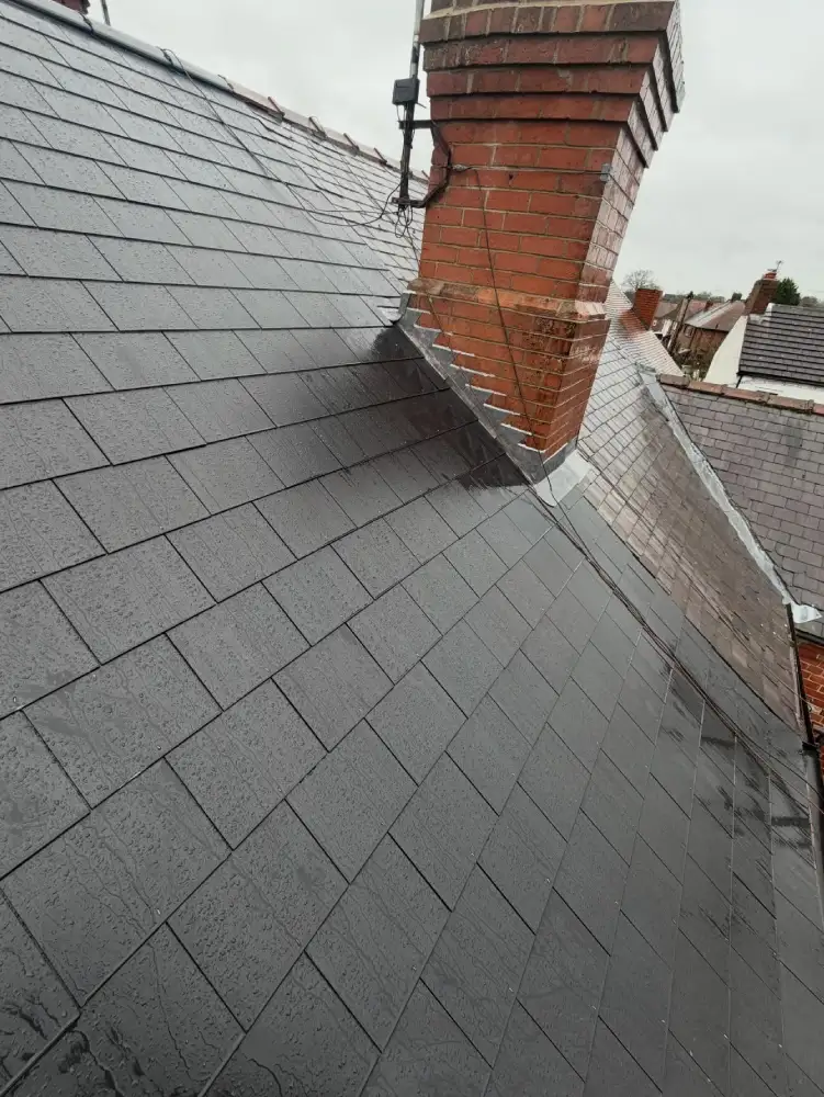 Roof slope and chimney detail on cement fibre slate reroof