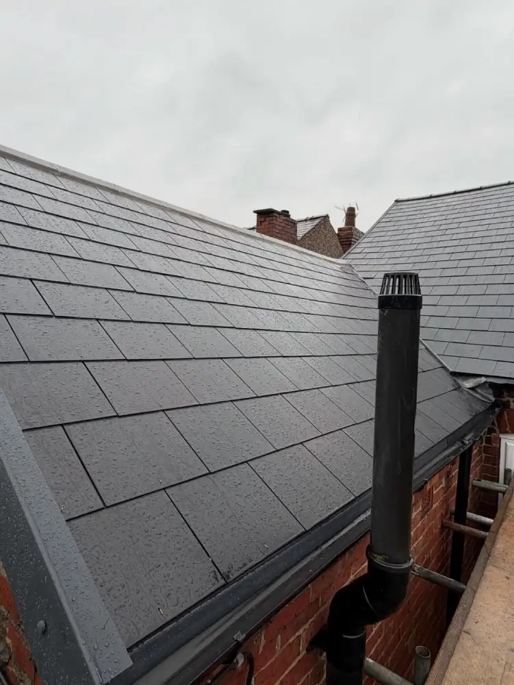 Rear roof angle showing cement fibre slates and roofline